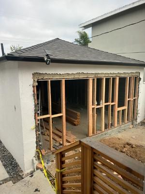 Accessory Dwelling Unit with garage door removed and replacement