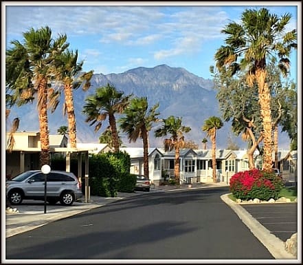 Caliente Springs RV park model community street with mountain view