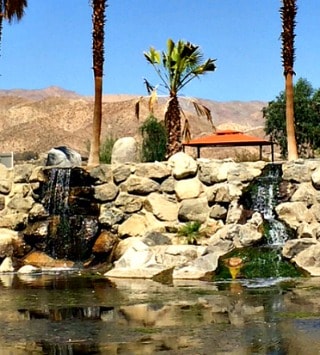 waterfall entrance to Caliente Springs in Desert Hot Springs CA