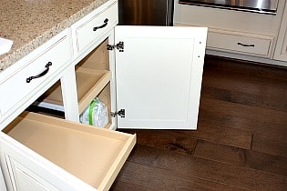 Courts of Clarksburg  with slide out drawers in kitchen.