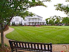 Heritage Hunt clubhouse with lawn and bench