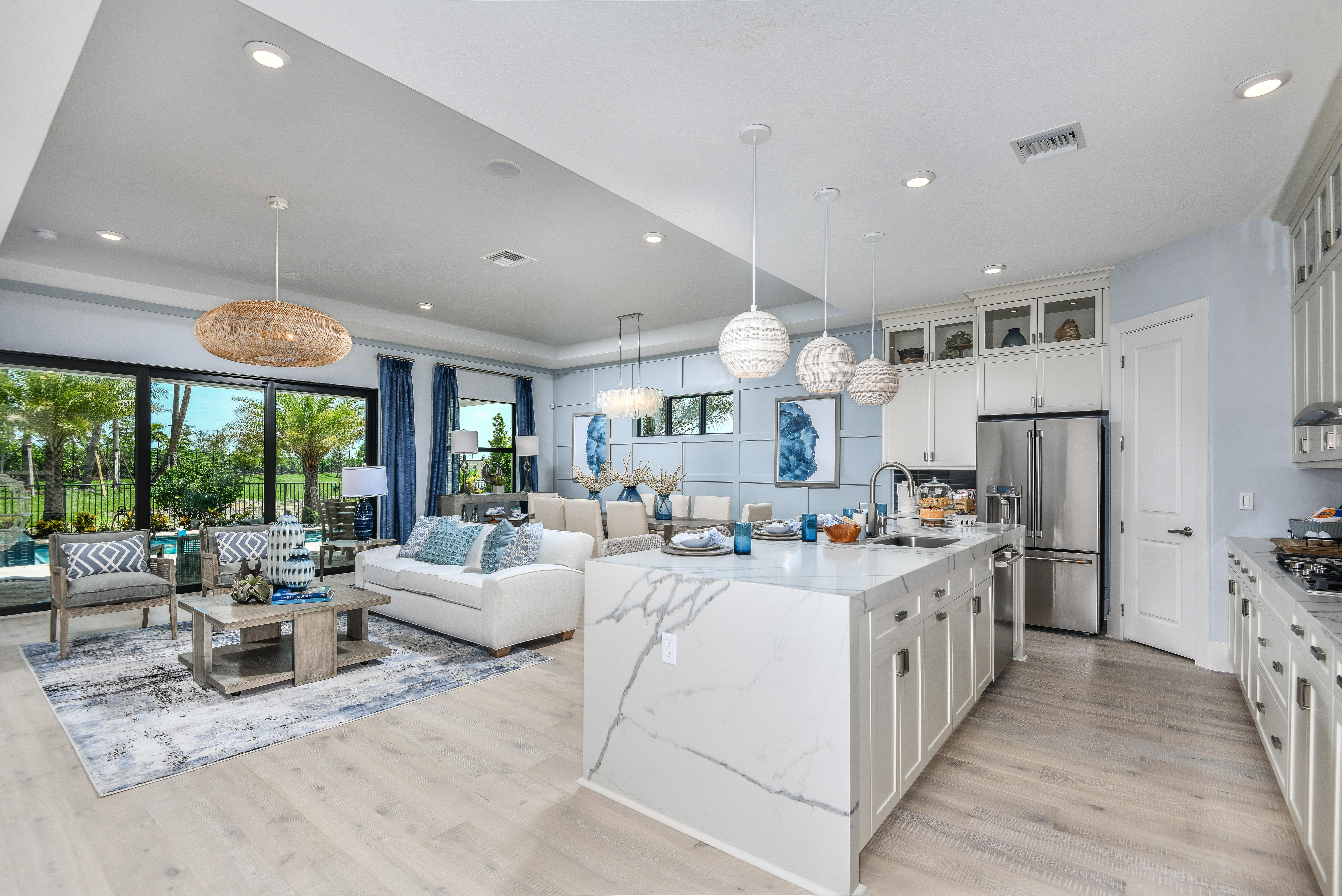 living room and kitchen in Cresswind Palm Beach model home.