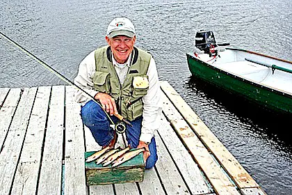 senior fisherman on dock