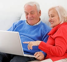 senior couple with laptop computer